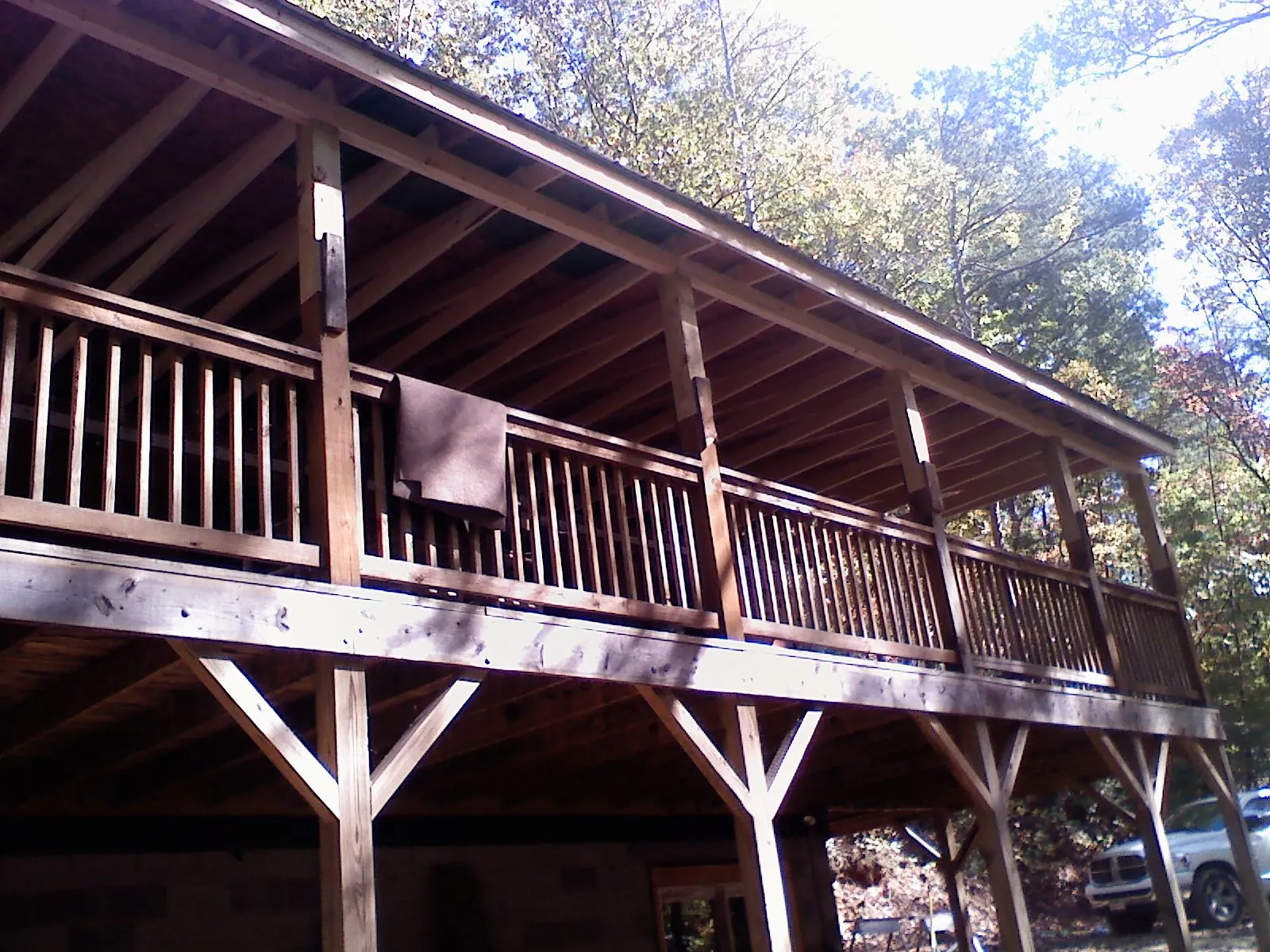 Timber framing under a new elevated porch and deck — Roof Leak Repair in East Hampton by Roofing Brothers